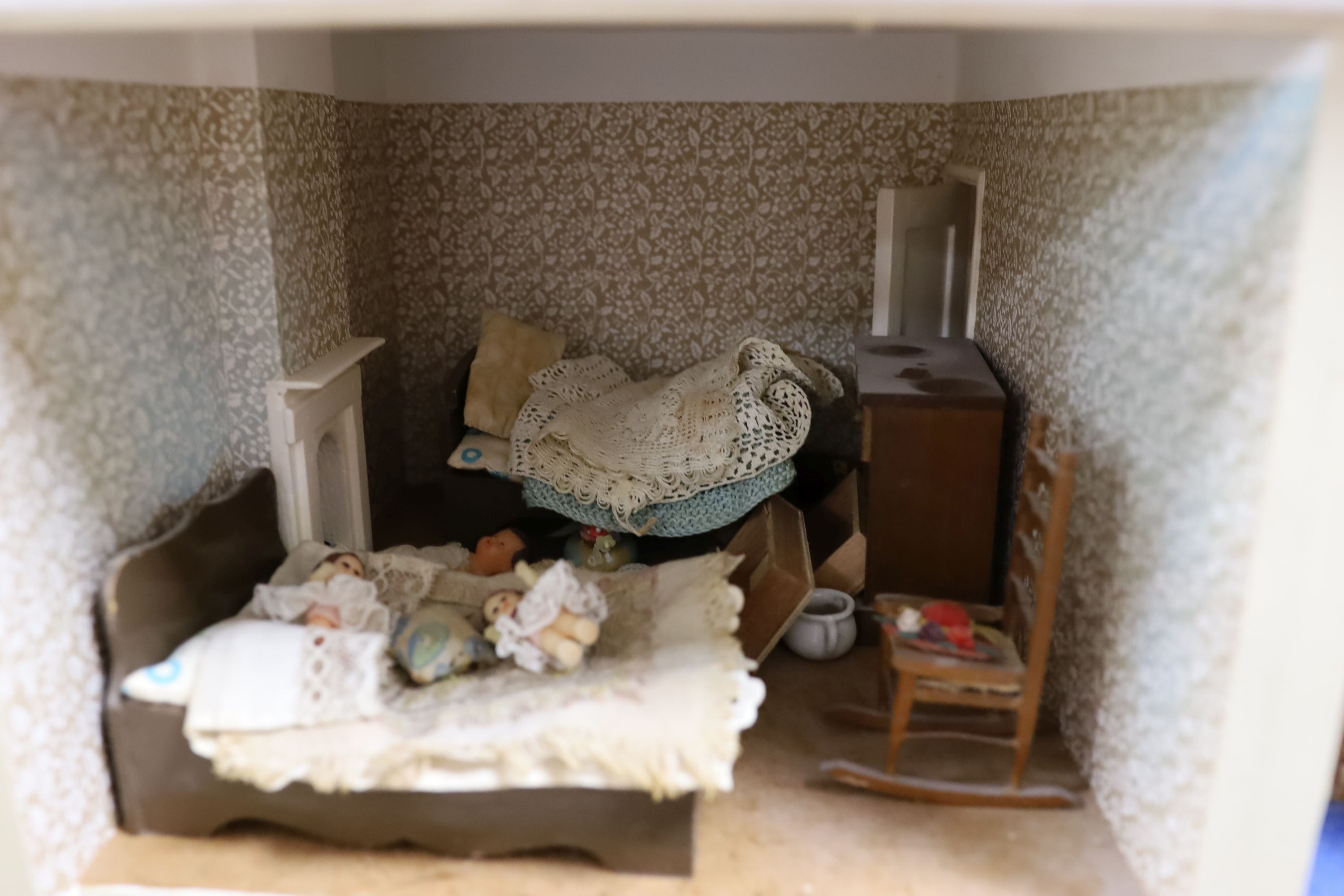 A dolls house, length 74cm, depth 39cm, height 66cm